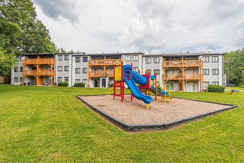 Playground with a slide at Pinewood Townhomes, Tucker, GA, 30084